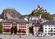 The capital of the Valais is Sion (or Sitten in German). Its two hills are capped by fortresses: Tourbillon (left) and Valeria (right). The view is towards the upper Rhone valley.